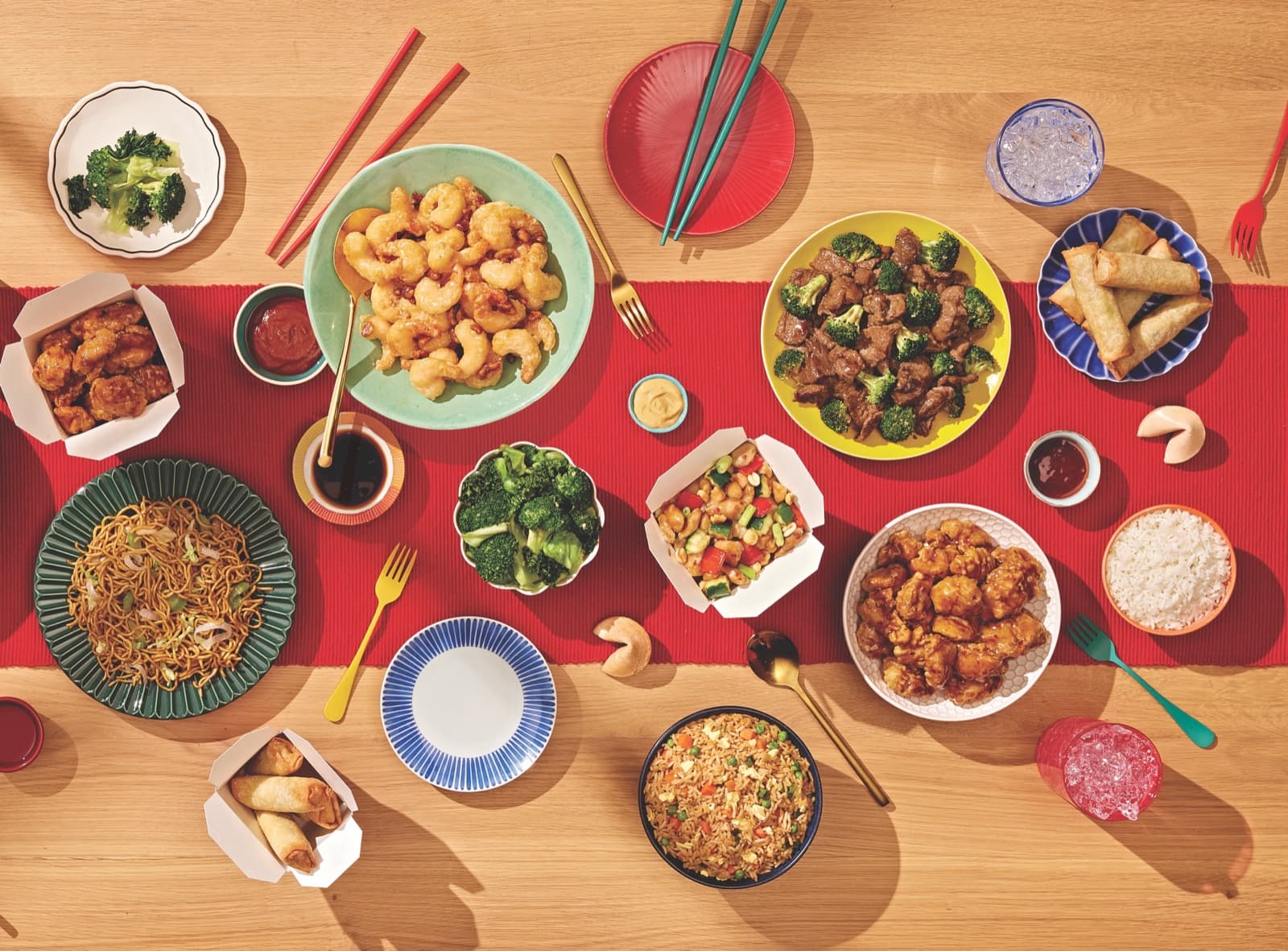 A spread of fresh Panda Express dishes including Orange Chicken, Beijing Beef, and fried rice